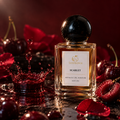 Scentience Scarlet Extrait de Parfum 50ml bottle with glossy black cherries, red roses and a cherry splash on a dark red background