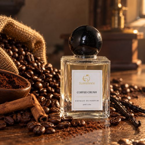 Scentience Coffee Crush extrait de parfum 50ml bottle in a mood shot with roasted coffee beans, cinnamon sticks and vanilla pods