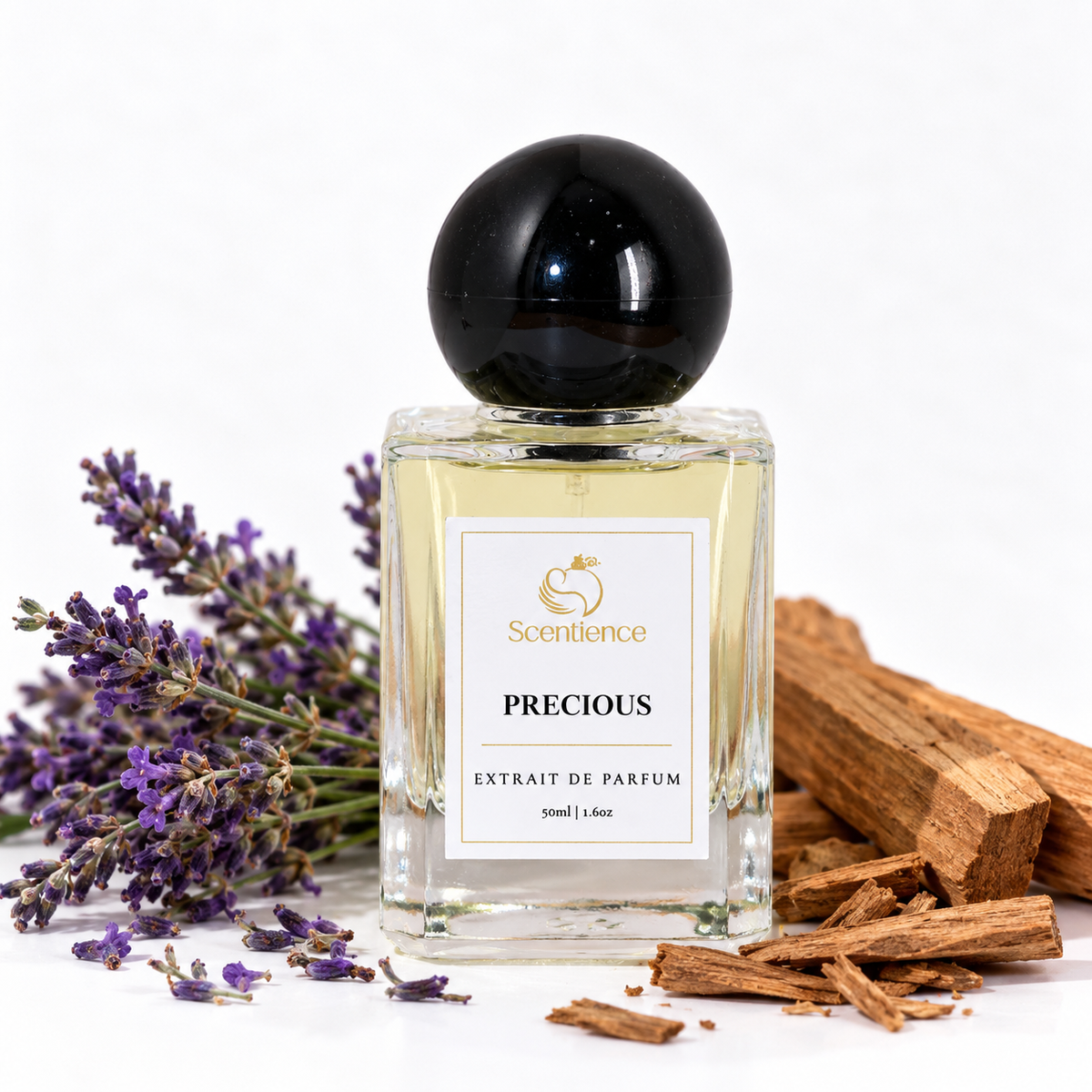 Scentience Precious extrait de parfum 50ml bottle beside lavender and sandalwood chips on a white background